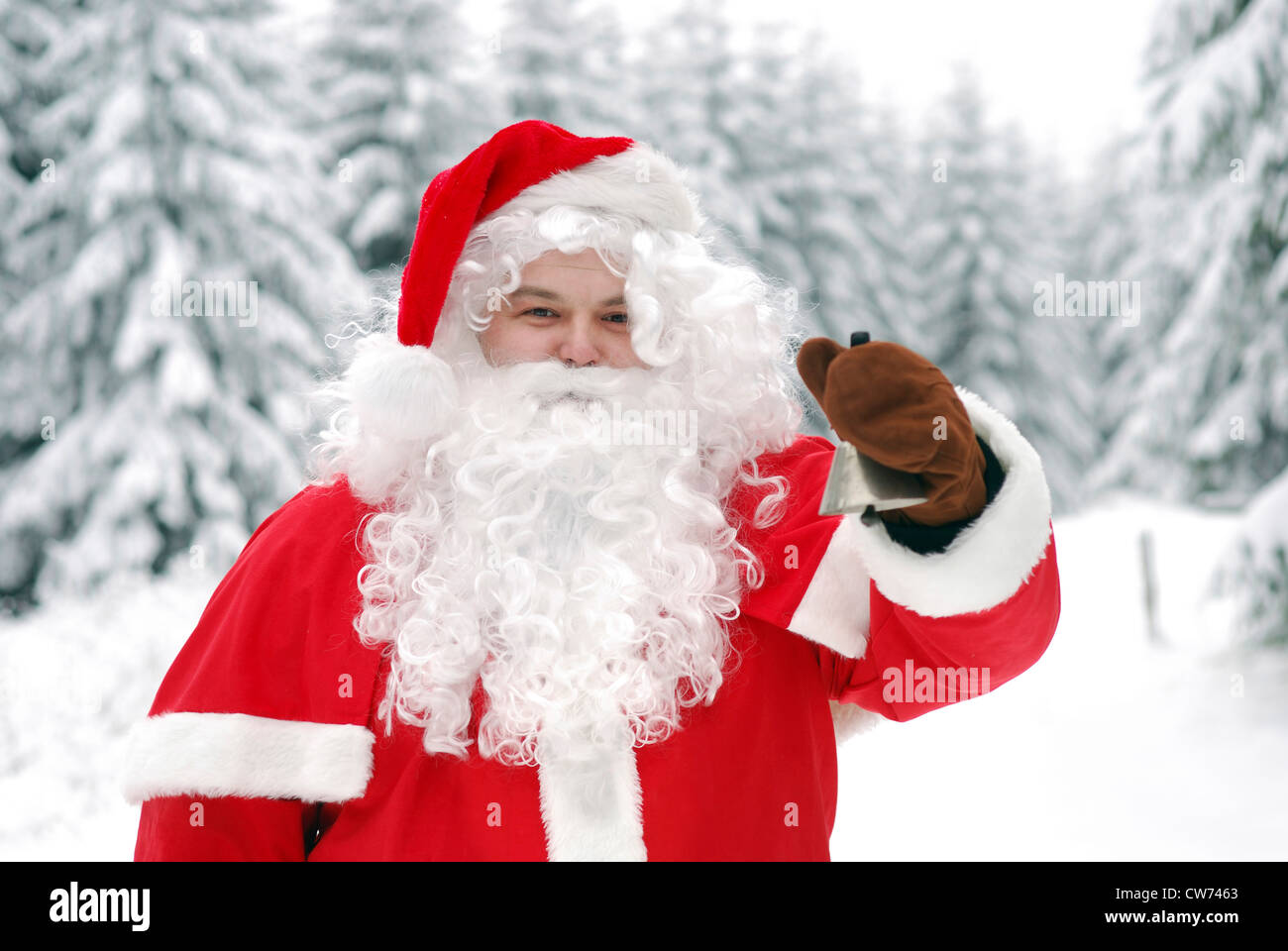 Le Père Noël dans la neige avec Bell Banque D'Images