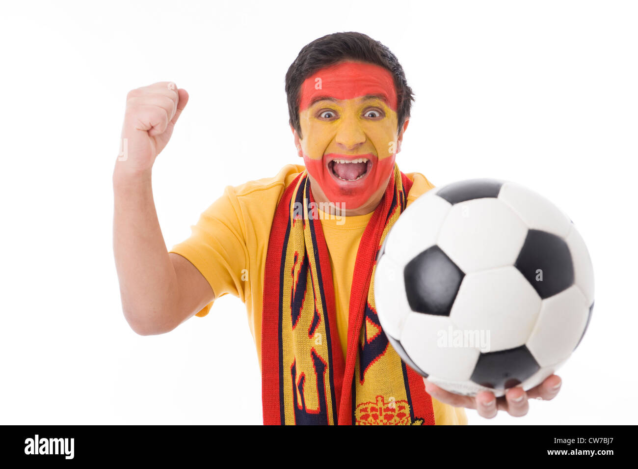 Fan de football espagnol euphorique holding football Banque D'Images