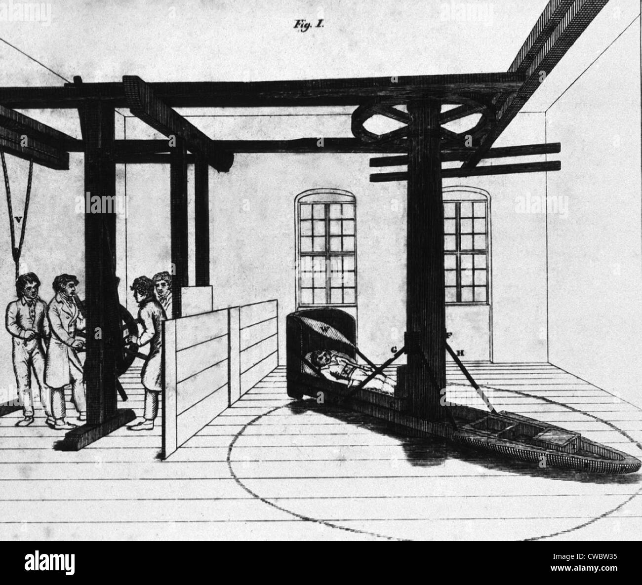 Patient en cours de traitement mentale dans une force centrifuge lit à l'hôpital Charité allemand au début du 19e siècle. Lithographie de Banque D'Images