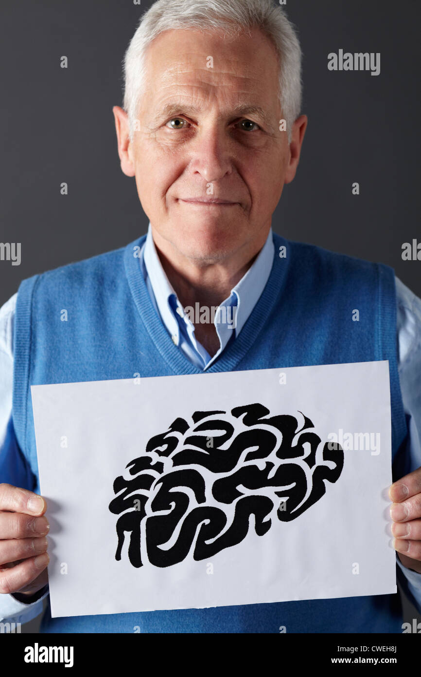 Senior man holding dessin à l'encre de cerveau Banque D'Images