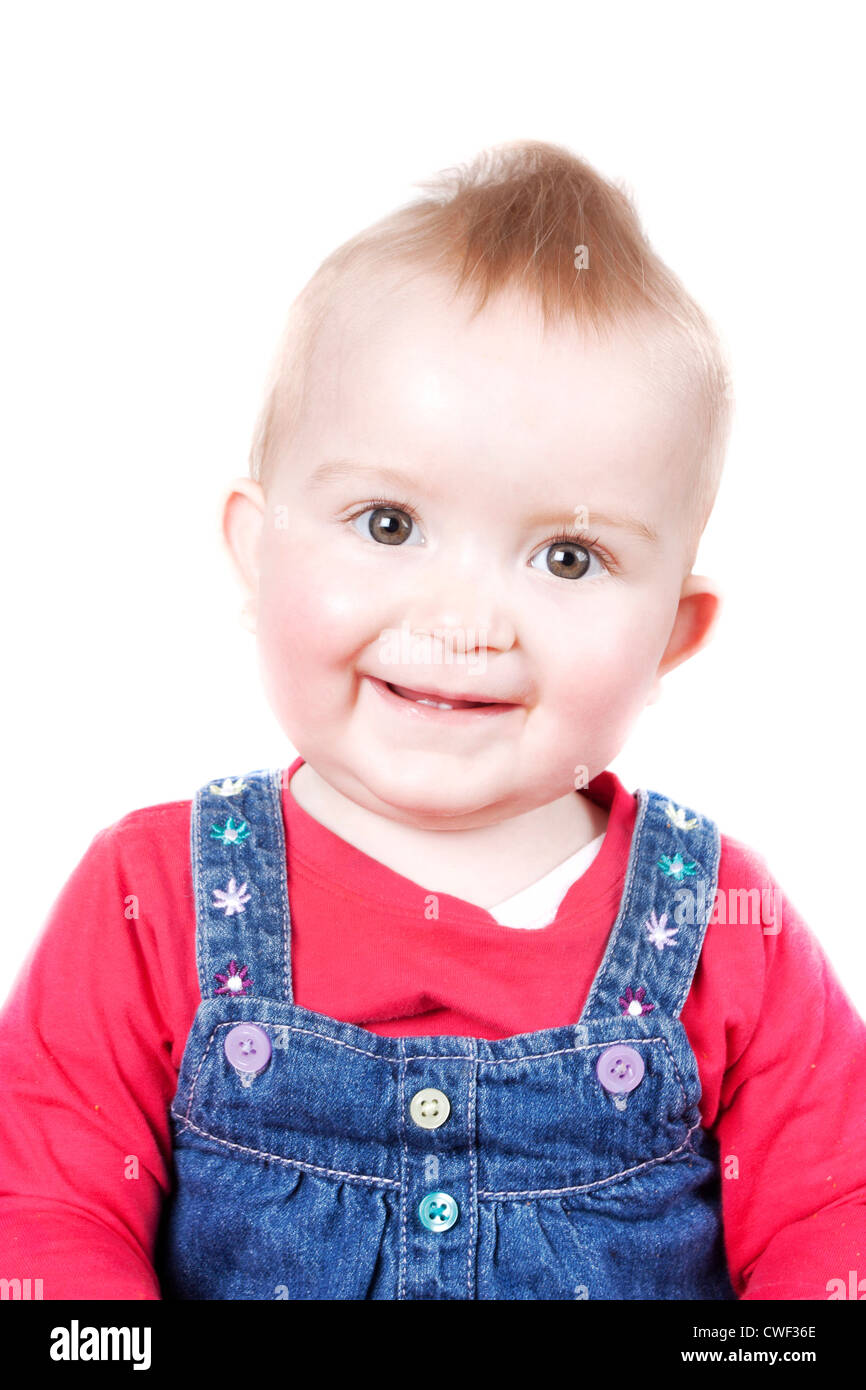 1 ans cute blonde girl smiling et caméras isolé sur fond blanc Banque D'Images