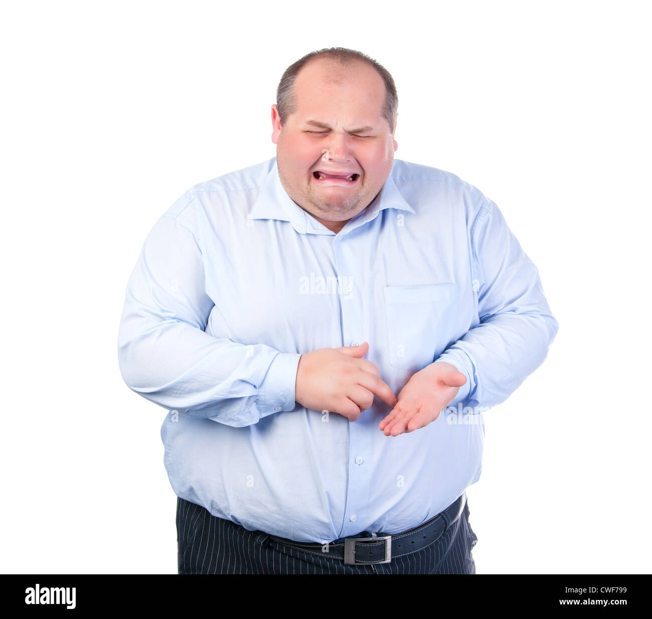 Gros homme malheureux dans une chemise bleue, isolé Photo Stock - Alamy