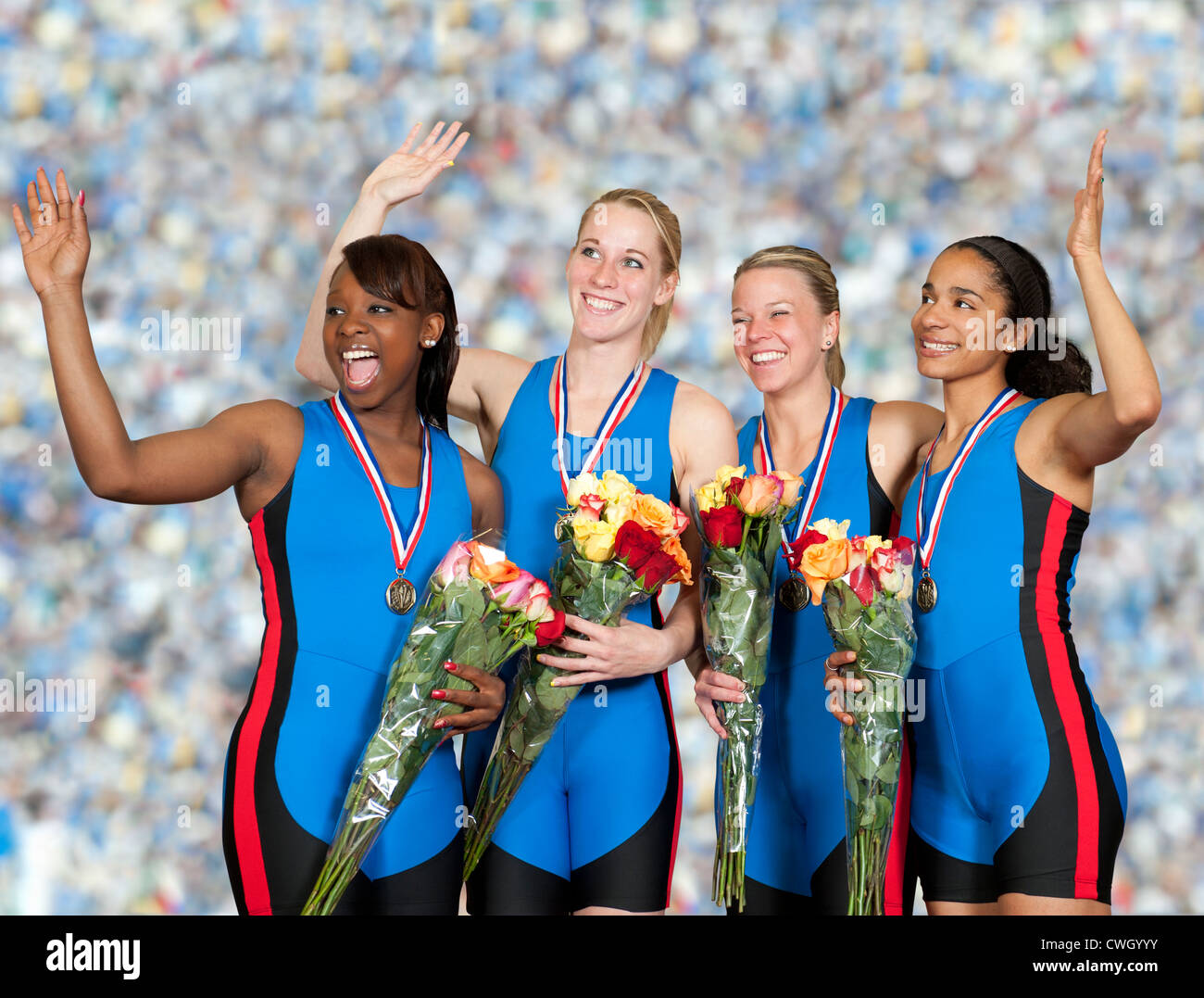 Les sportives avec des médailles holding bouquets Banque D'Images