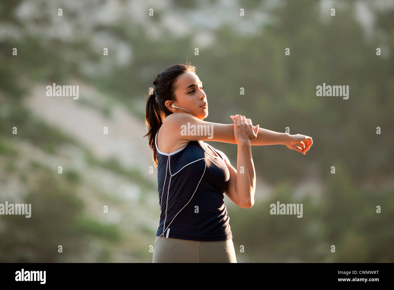 France, Marseille, young woman stretching Banque D'Images
