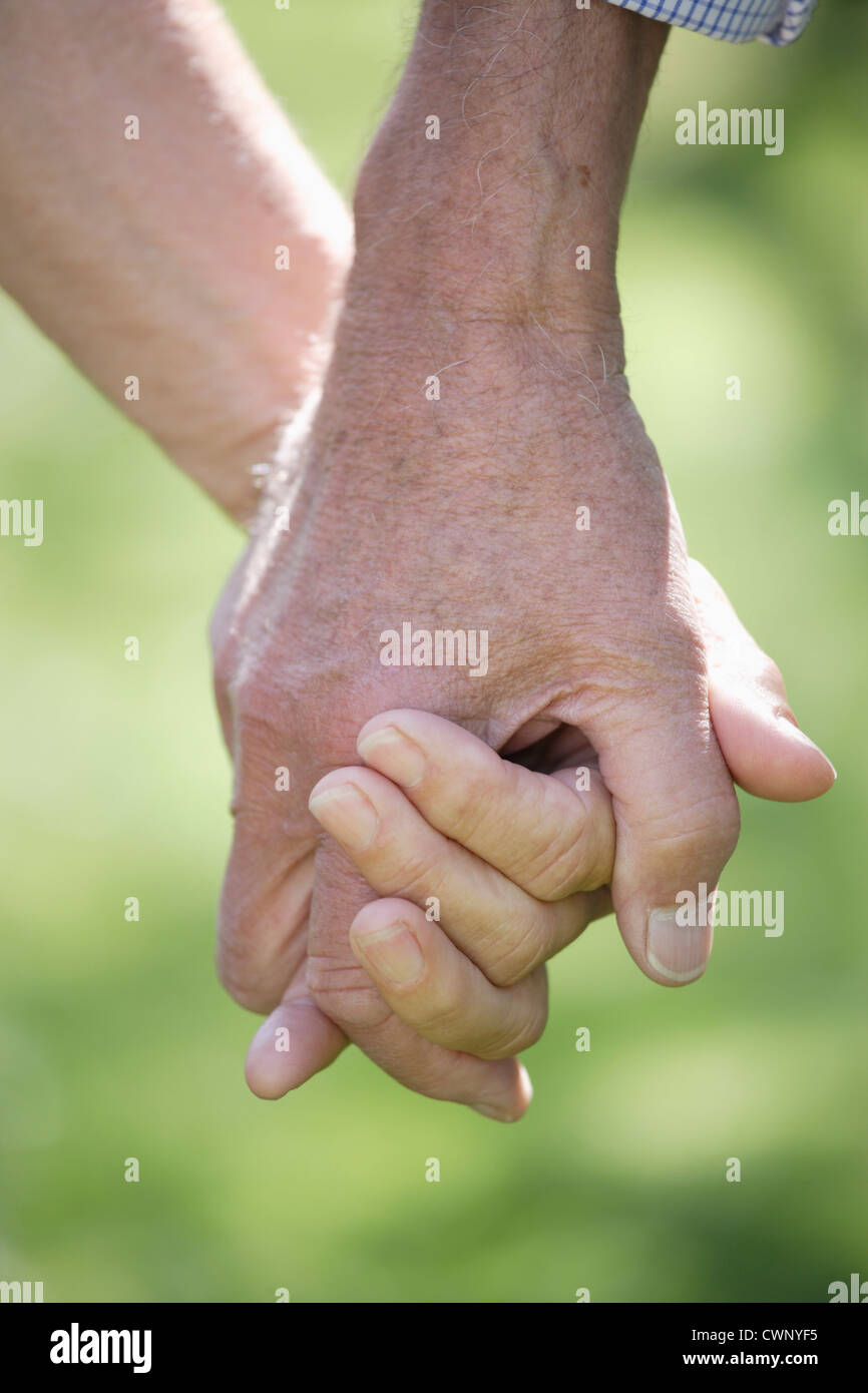 Germany, Bavaria, Senior couple holding hands, Close up Banque D'Images