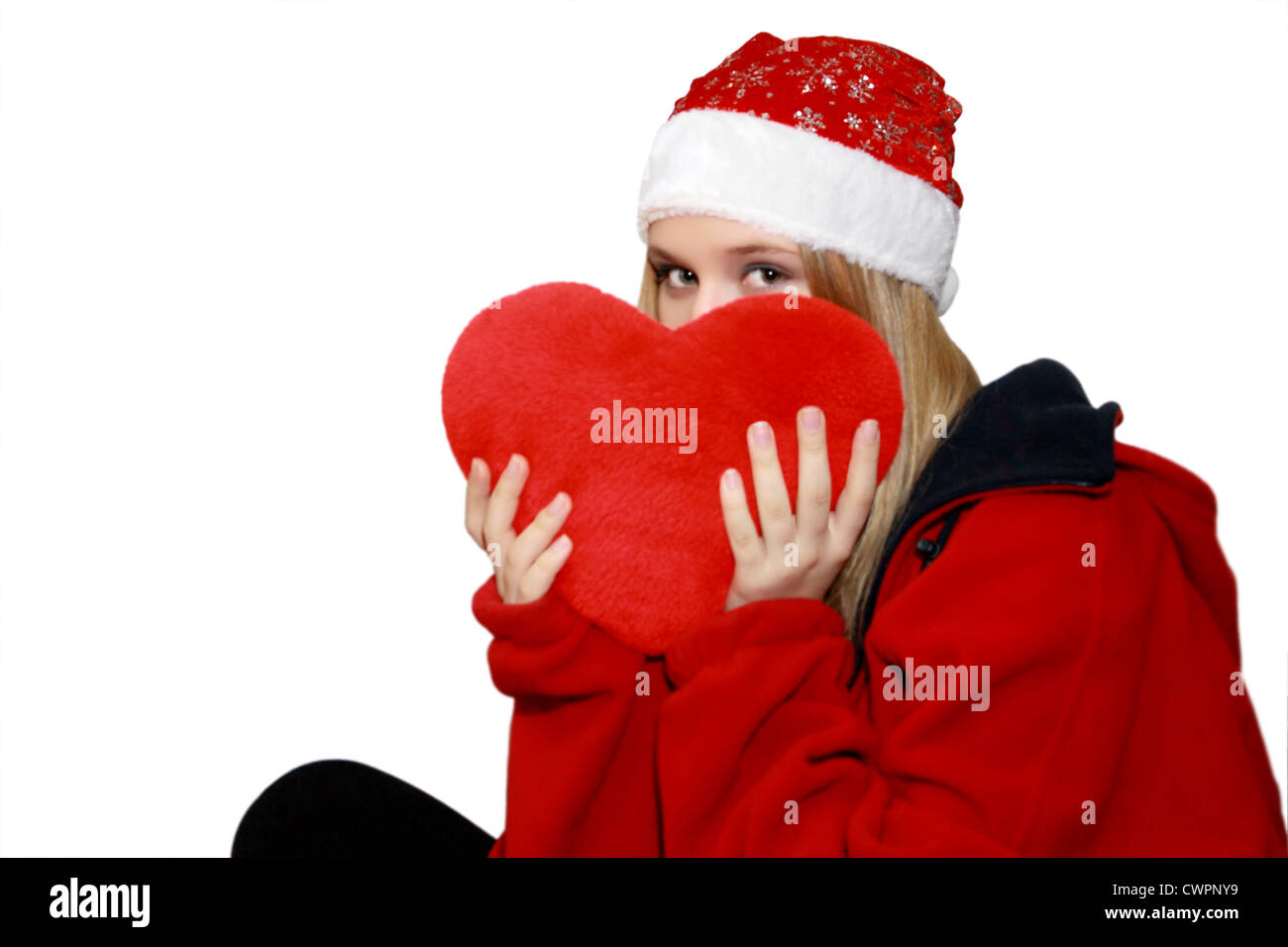 Jeune fille avec un coeur entre les mains de Noël Banque D'Images