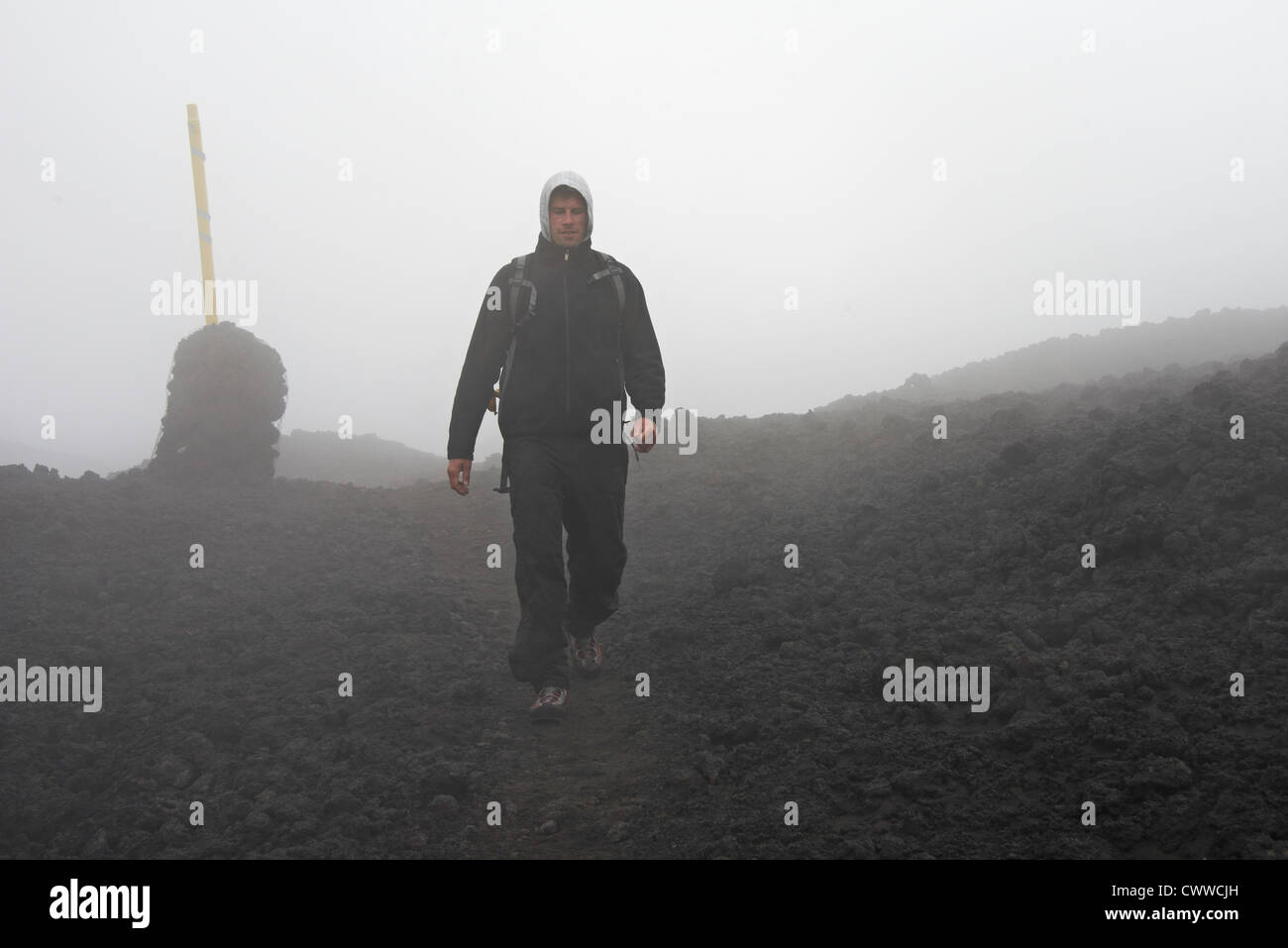 Rocky man walking in rural landscape Banque D'Images