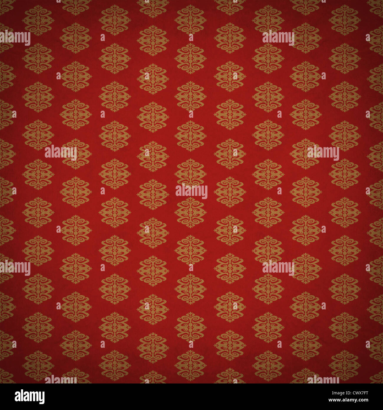 La feuille d'or et rouge antique vieux papier peint avec un style rétro antique victorian style de motif texturé avec un élément de design à l'ancienne. Banque D'Images