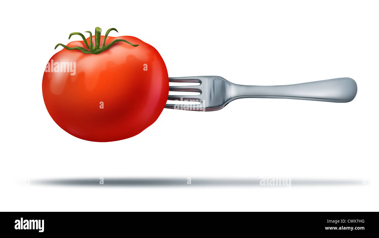 Aliments entiers santé montrant une tomate rouge juteux organique naturel avec une fourche en métal de l'argent qu'il représente une saine alimentation et de suivre un régime végétarien ou de vie. Banque D'Images