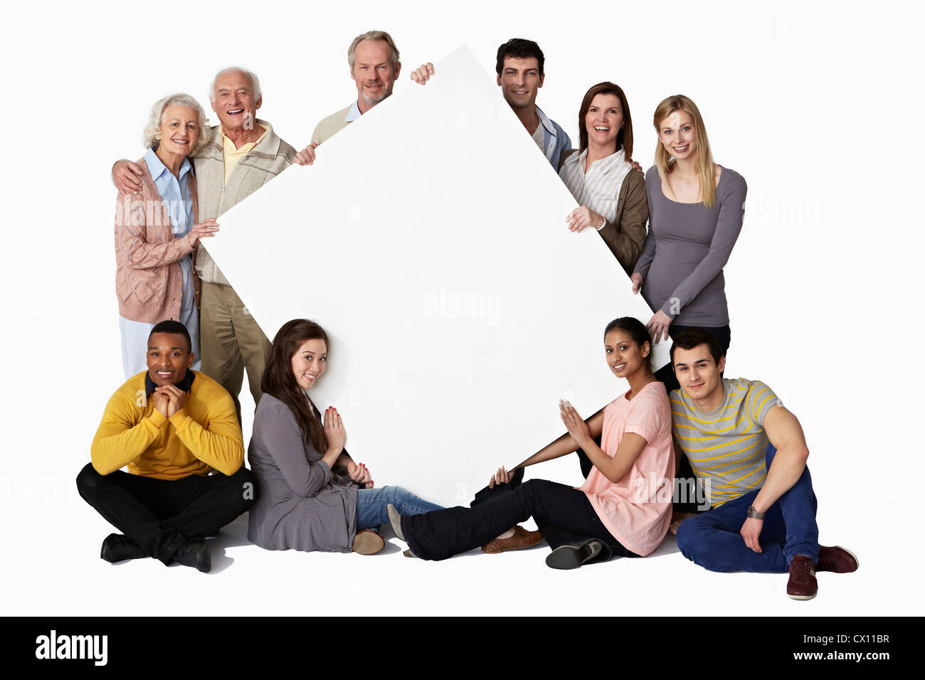 Groupe de personnes holding blank notice board Banque D'Images
