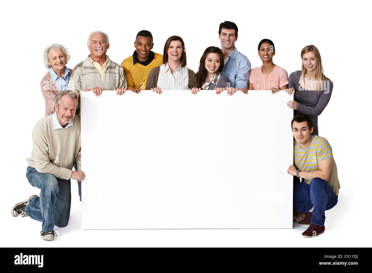 Groupe de personnes holding blank notice board Banque D'Images