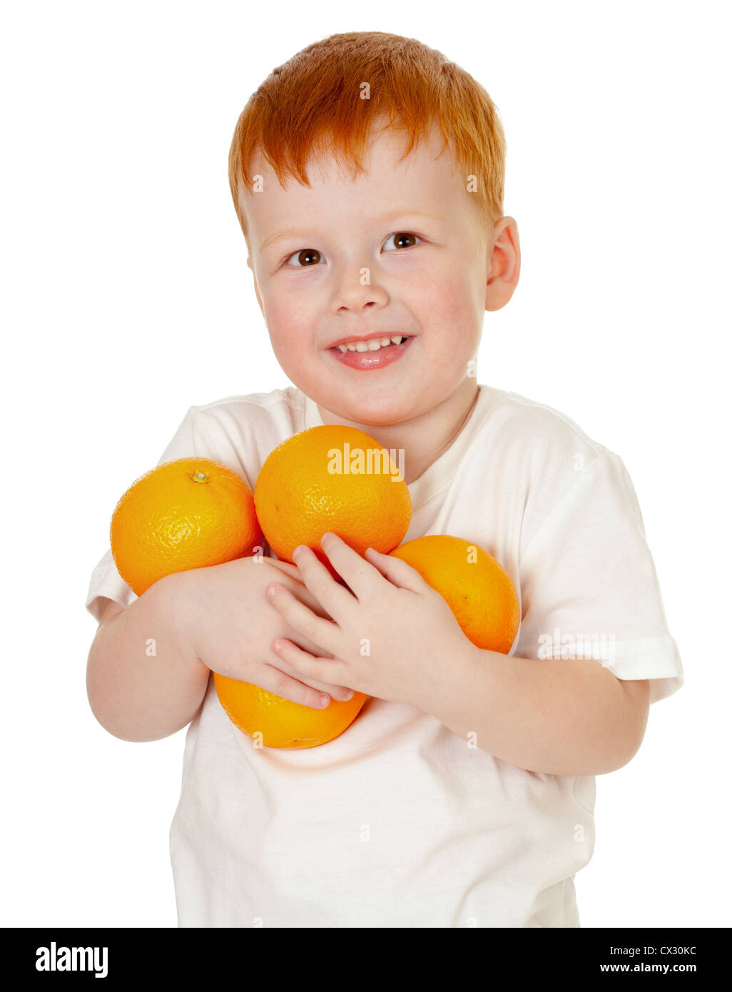 Garçon roux avec les oranges isolated on white Banque D'Images