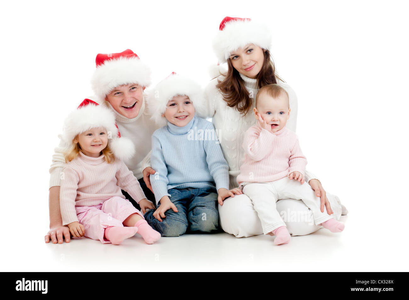 Happy Family lying on floor in studio isolated on white Banque D'Images