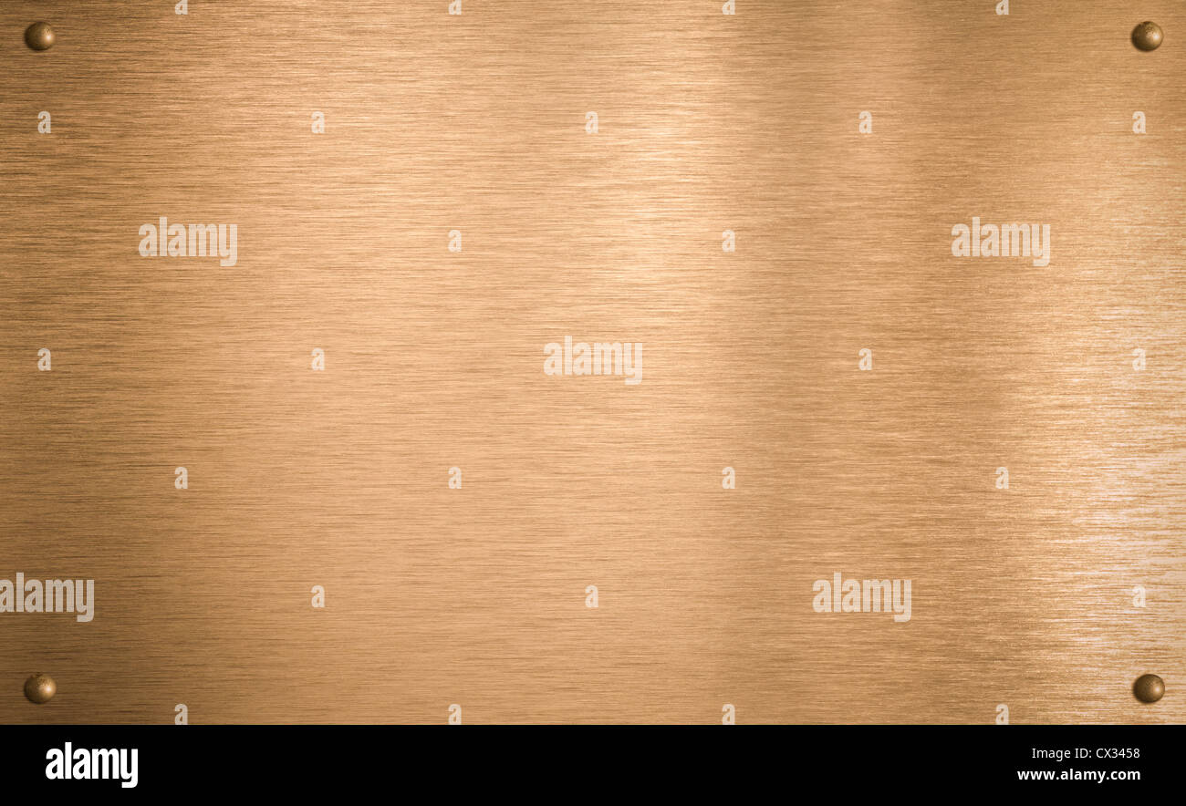 Plaque en métal bronze avec quatre rivets Banque D'Images