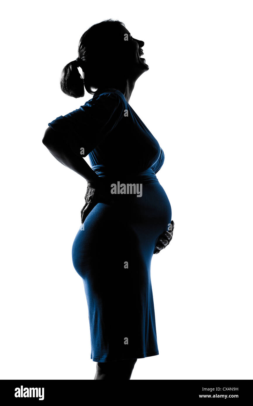 Belle caucasian pregnant laughing woman en silhouette sur fond blanc isolé studio Banque D'Images