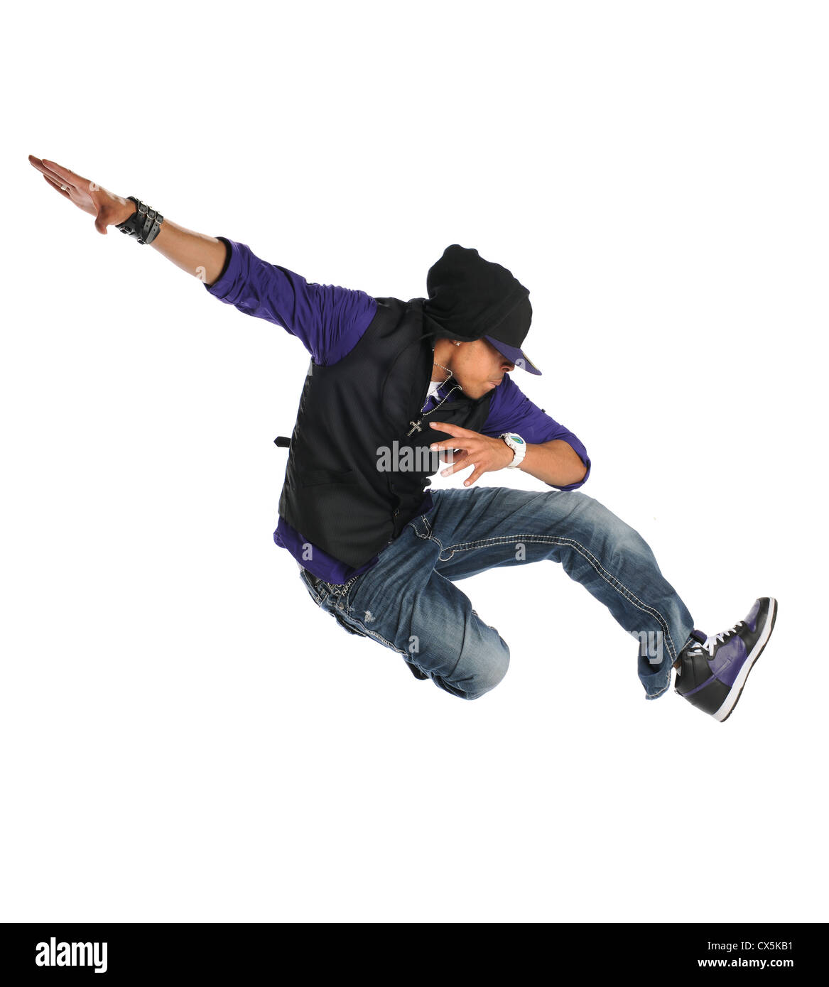 African American hip hop dancer jumping over white background Banque D'Images