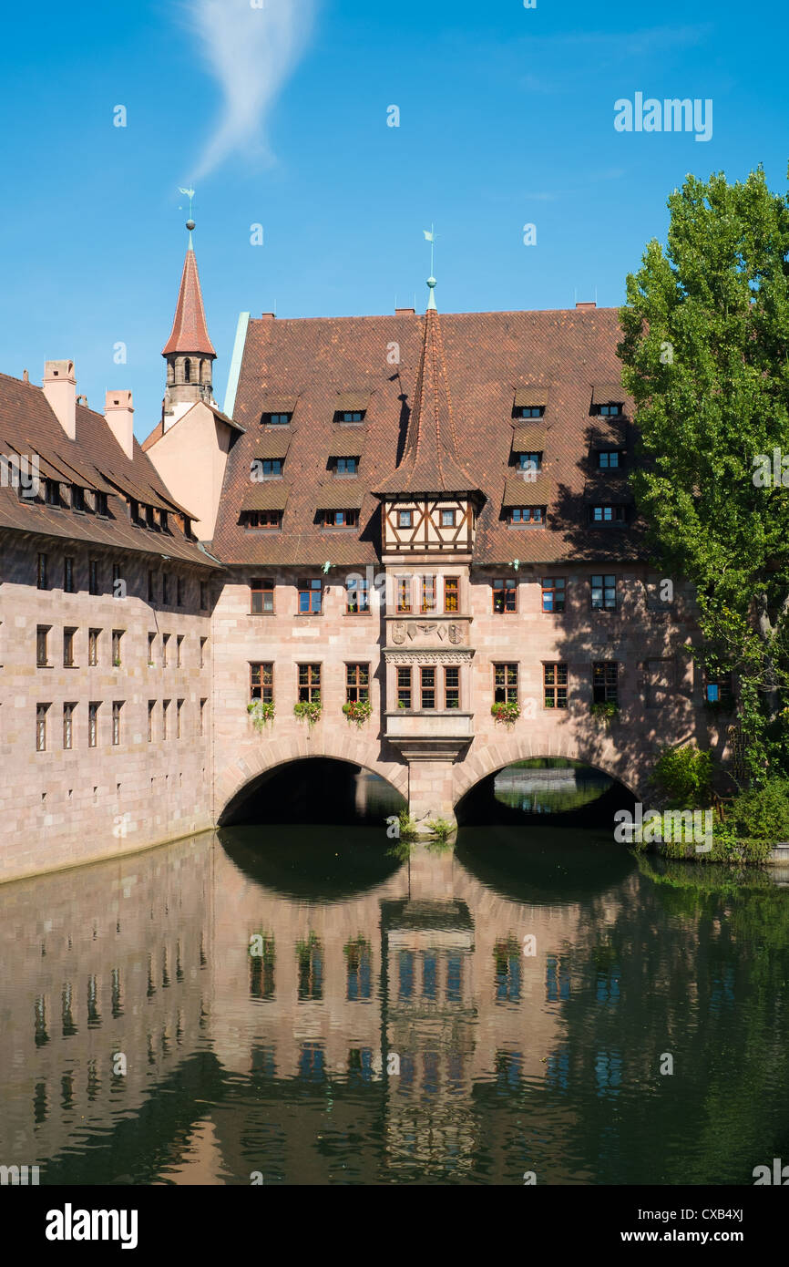 La Heilig Geist Spital ou hôpital Saint-esprit à Nuremberg en Bavière, Allemagne Banque D'Images