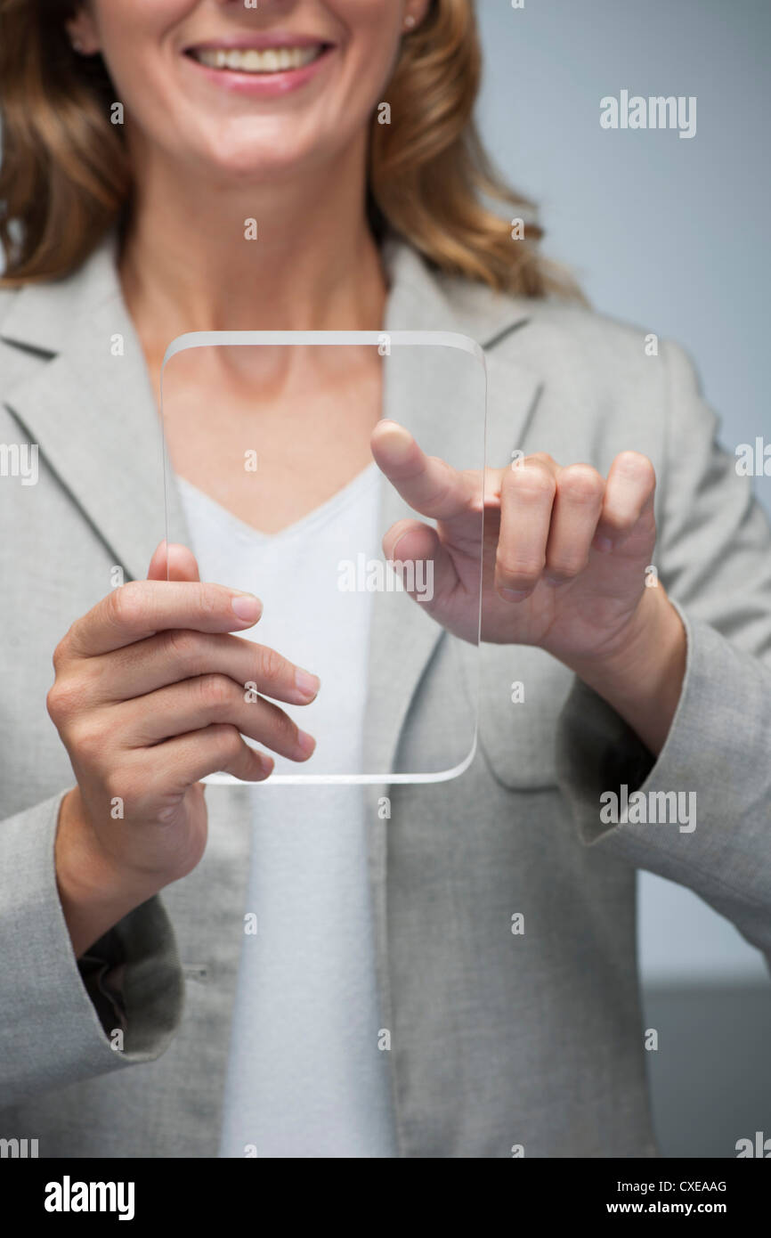 Businesswoman using digital tablet transparent Banque D'Images