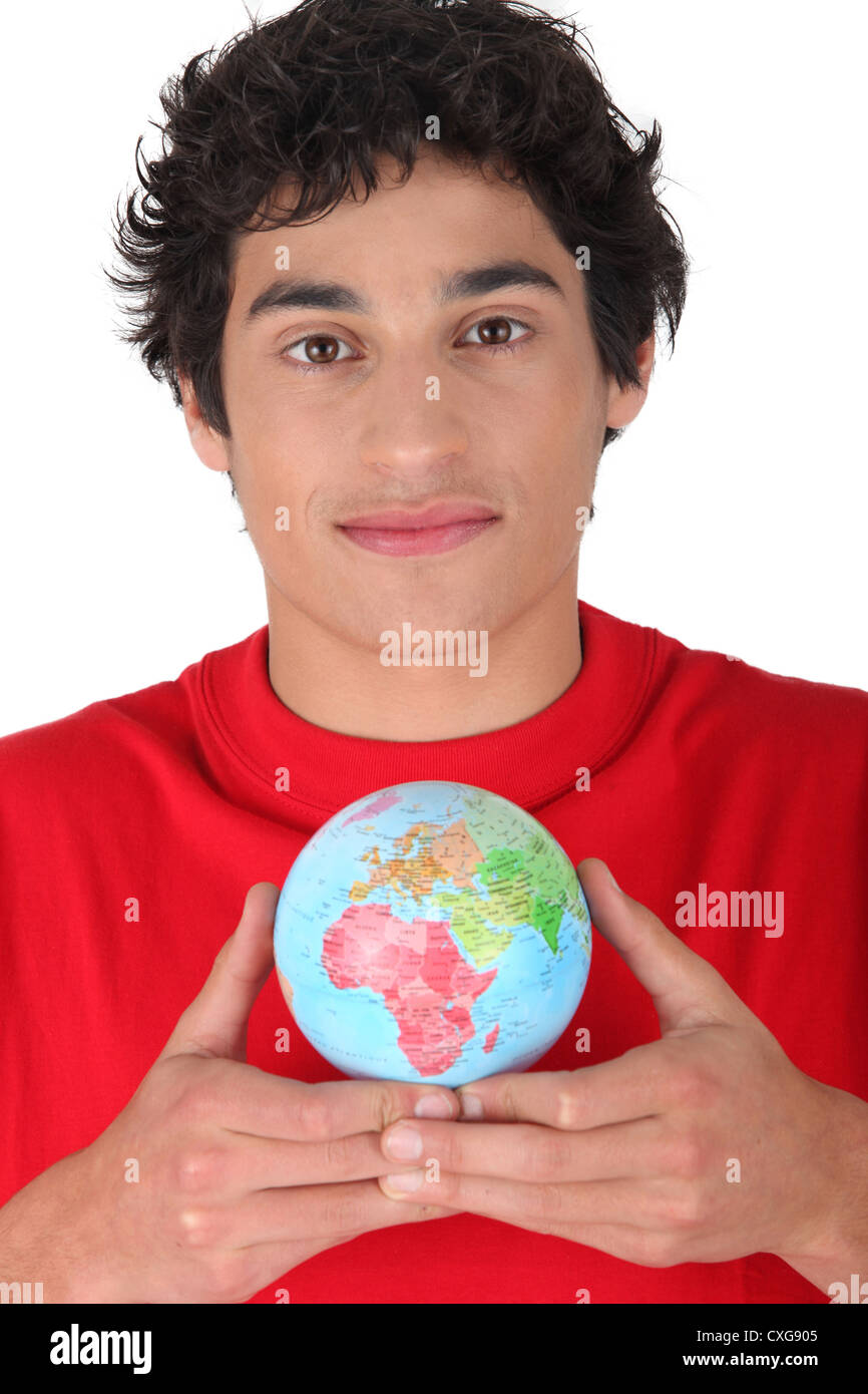 Man holding globe miniature Banque D'Images