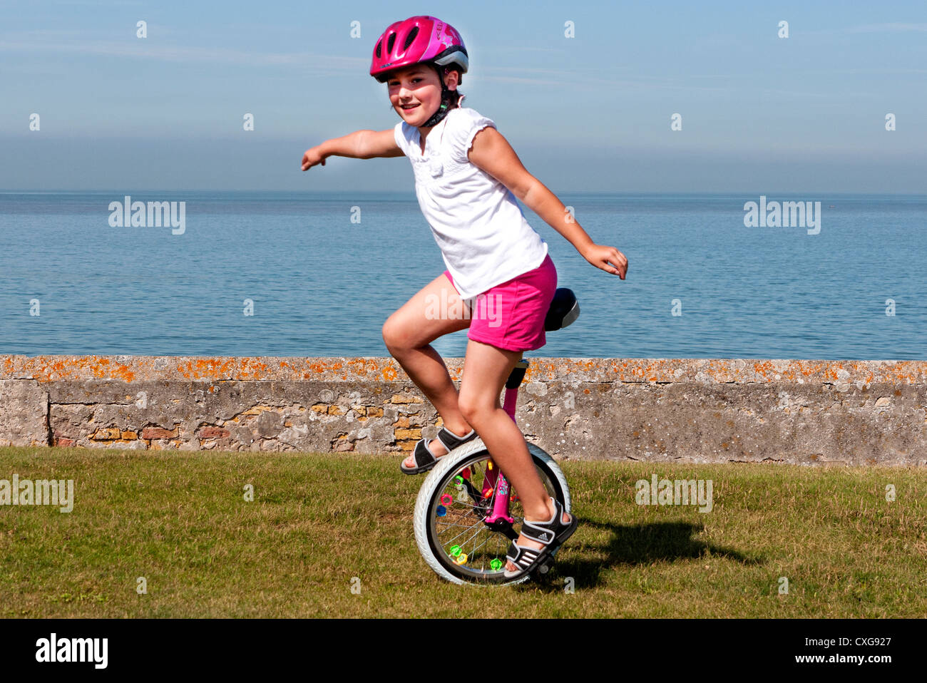 Fille de la mer le monocycle Banque D'Images