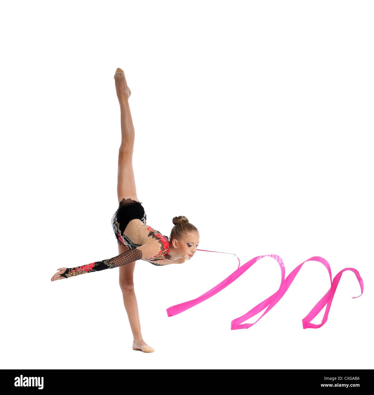 Adolescent doing gymnastics split avec ruban Banque D'Images