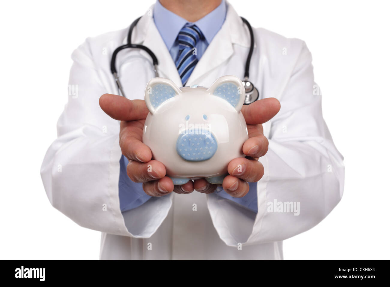 Doctor holding piggy bank Banque D'Images