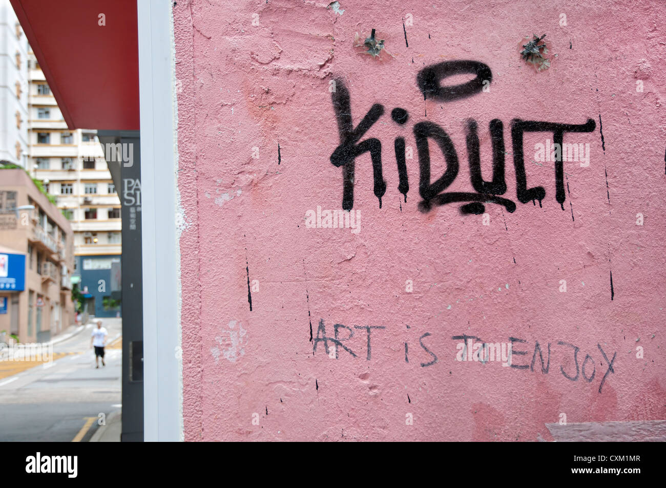 Le graffiti à Sheung Wan, Hong Kong, par l'artiste graffiti kidult Banque D'Images