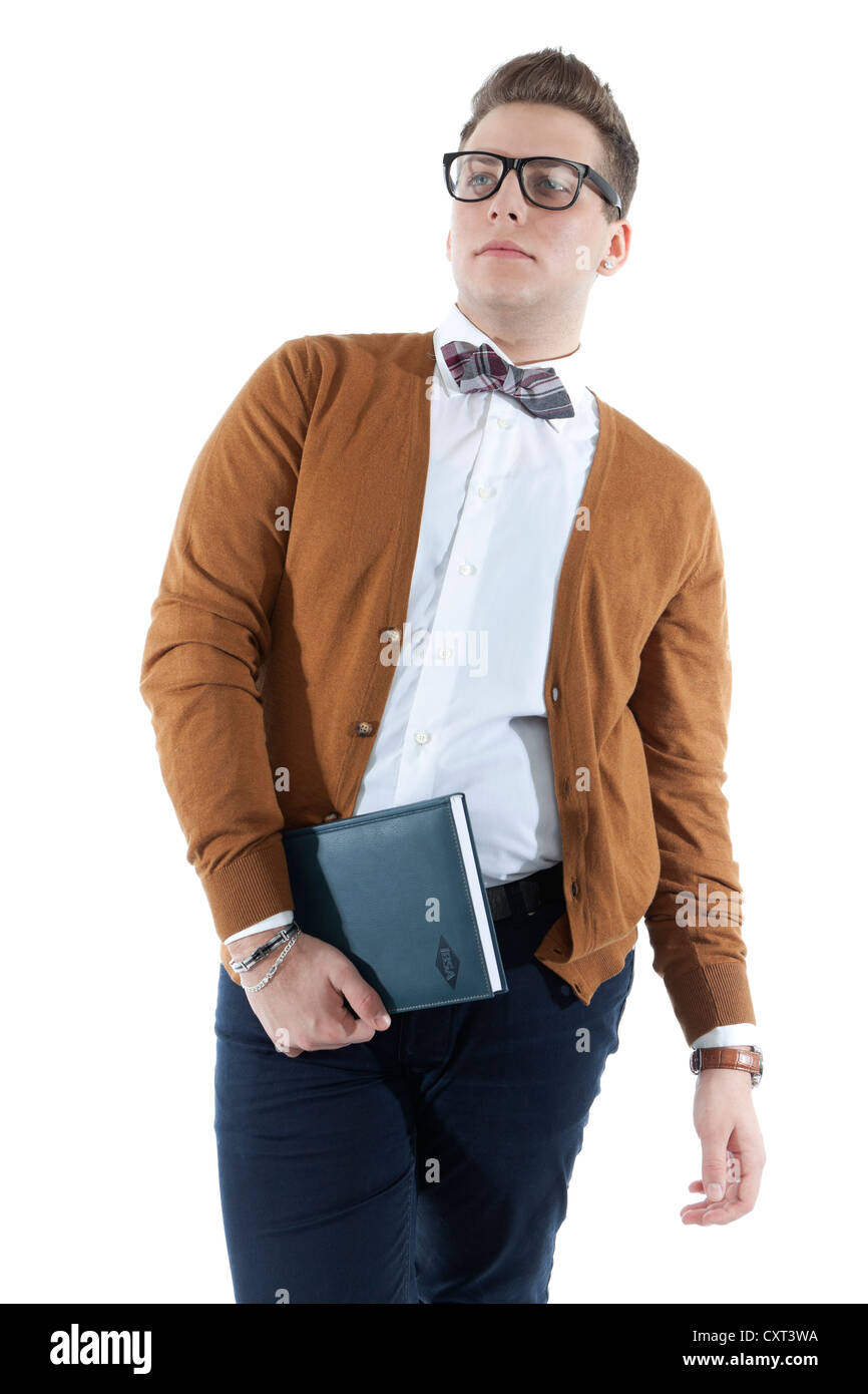 Jeune homme avec des lunettes et un chapeau tenant un livre, journal intime Banque D'Images