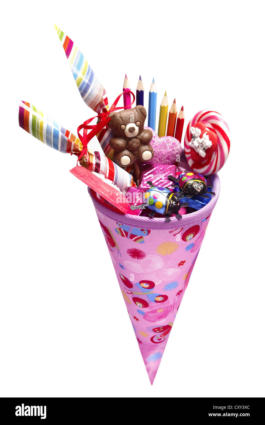 Schultuete ou cône rose école rempli de cadeaux et de bonbons Banque D'Images