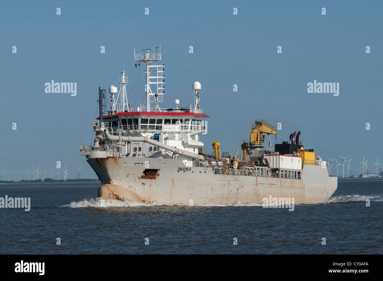 Drague, 'Travail' Taccola bateau sur l'estuaire de la baie Dollart, près de l'Emden, Basse-Saxe Banque D'Images