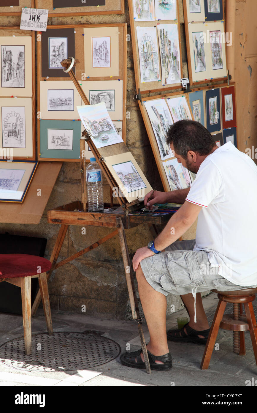 La peinture de l'artiste à l'aide de la vieille ville de Rethymnon chevalet, Crète, Grèce Banque D'Images