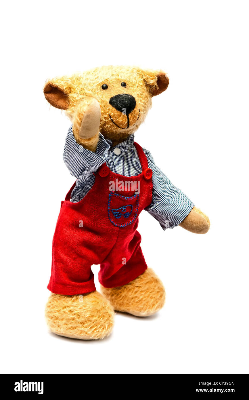 Toy - un ours avec un pantalon rouge avec un fond blanc Banque D'Images