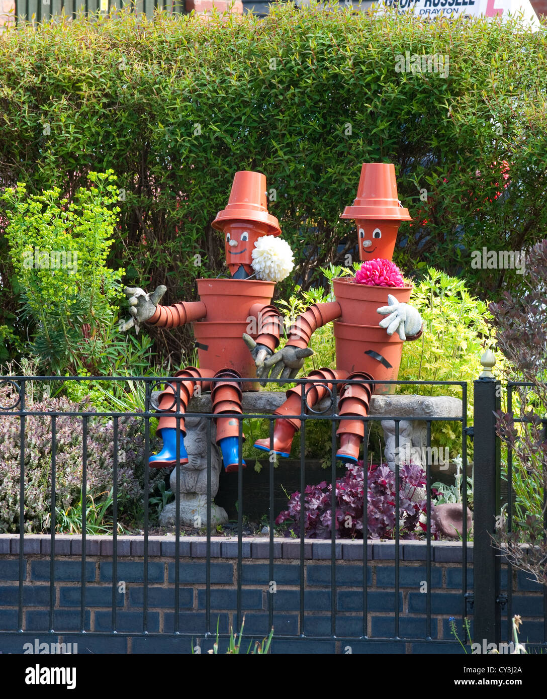 Bill & Ben, le pot de fleurs les hommes sur le marché du canal de Shropshire Union, Drayton, Shropshire, Angleterre. Banque D'Images