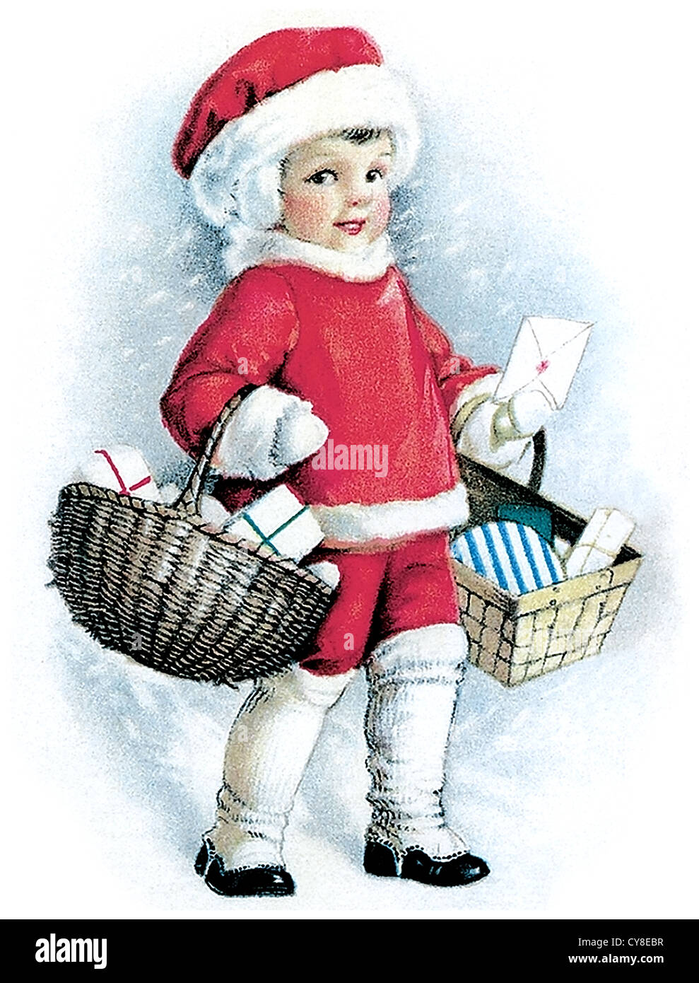 Enfant avec des paniers en robe de Noël Banque D'Images