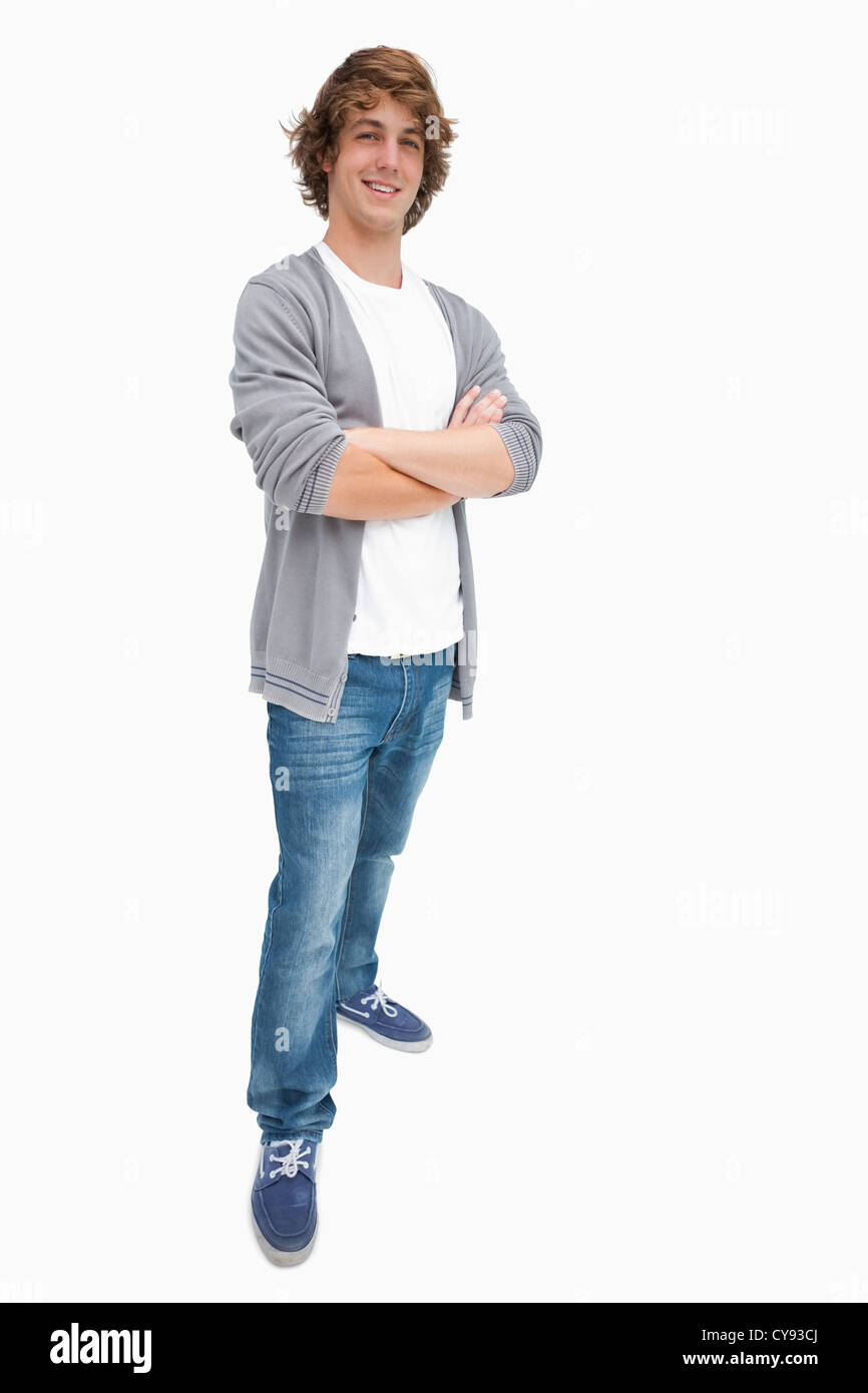 Smiling male student posing in jeans Banque D'Images