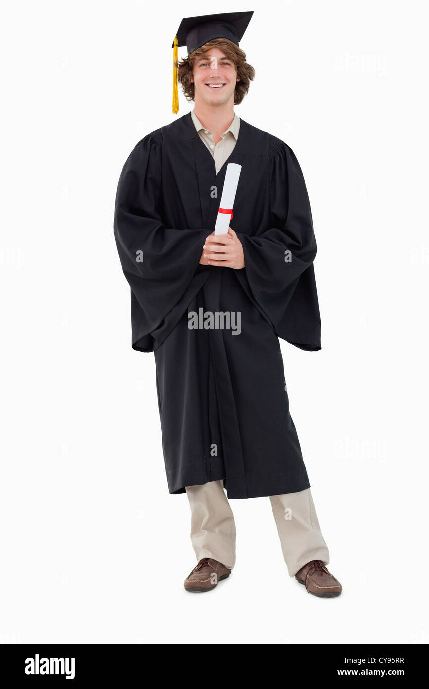 Smiling student in robe de deuxième cycle Banque D'Images