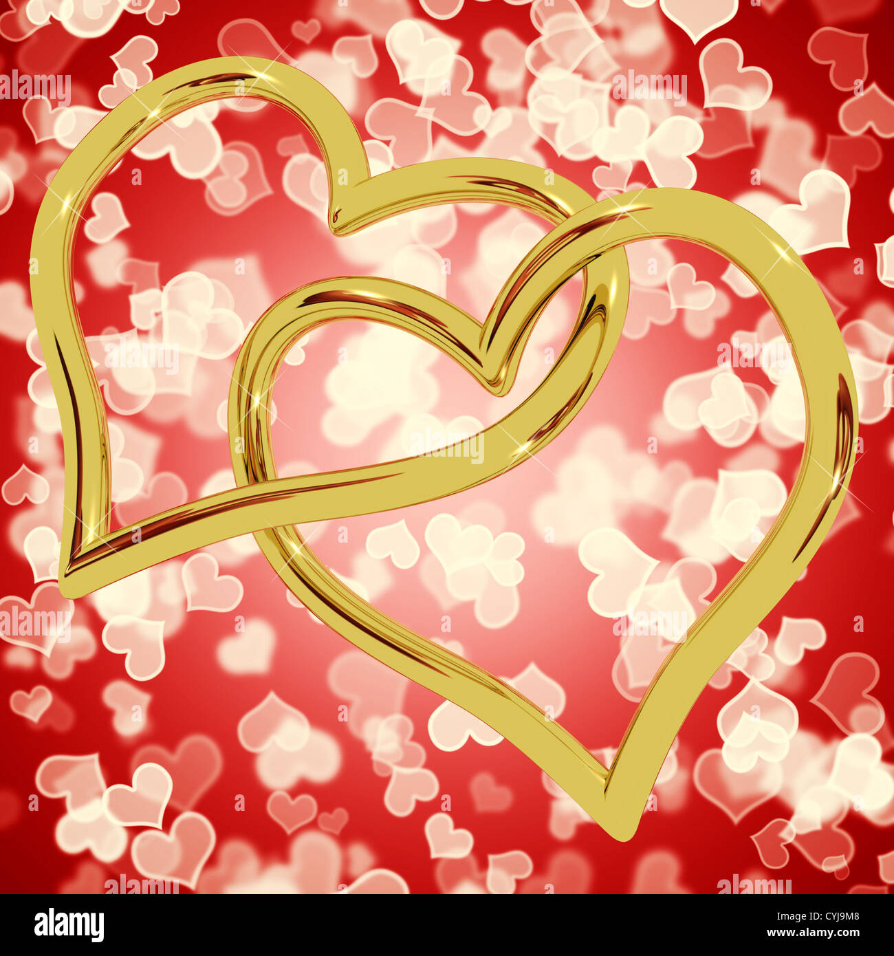 Les anneaux en forme de coeur en or sur rouge représente l'Amour et romance Bokeh Banque D'Images