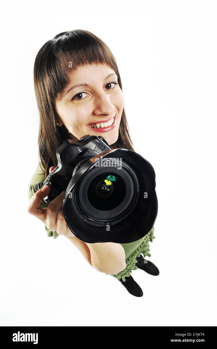Une jeune fille est titulaire d'un appareil photo. Banque D'Images