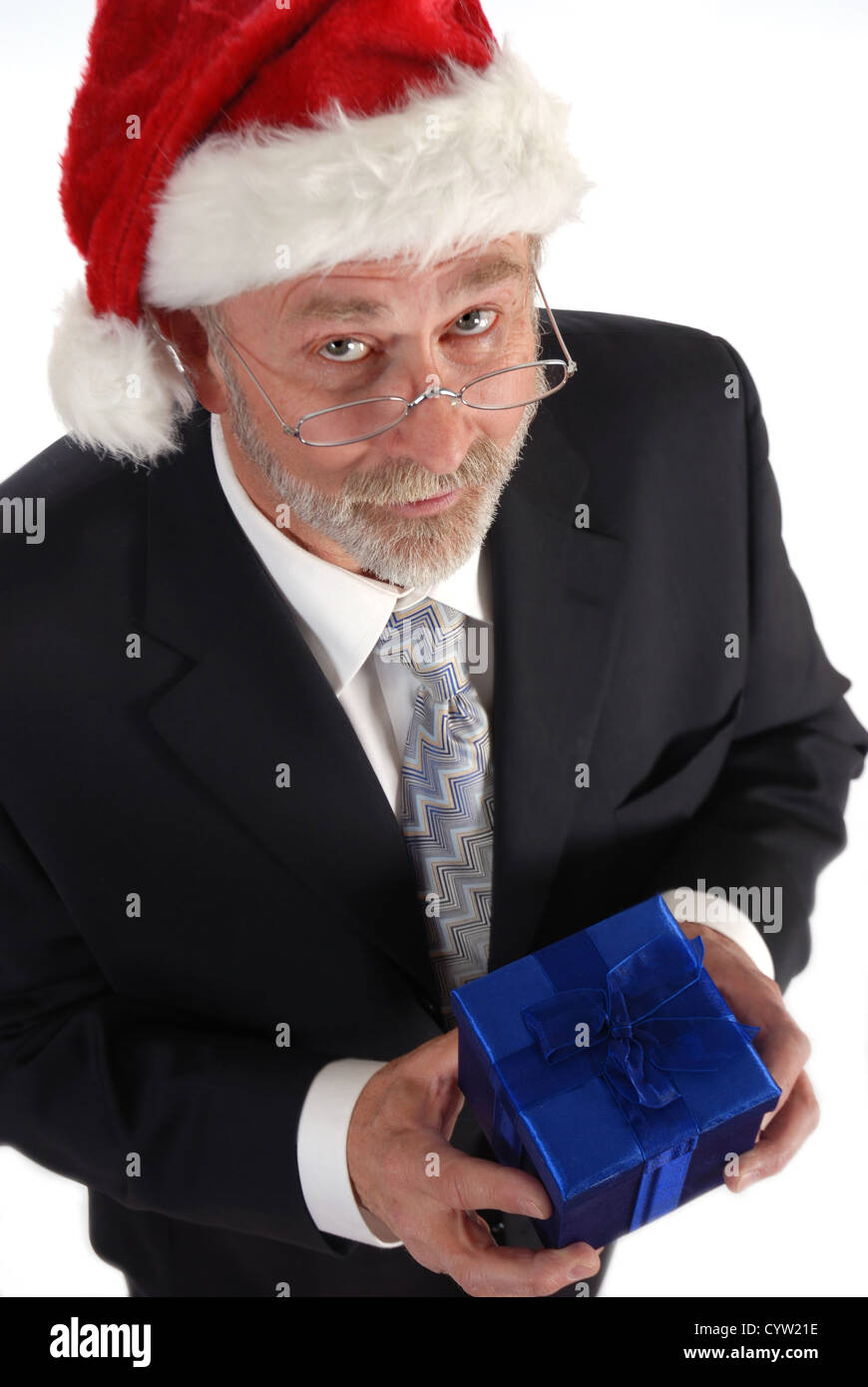 Senior Businessman with cadeau de Noël et de Santa Claus hat. Banque D'Images