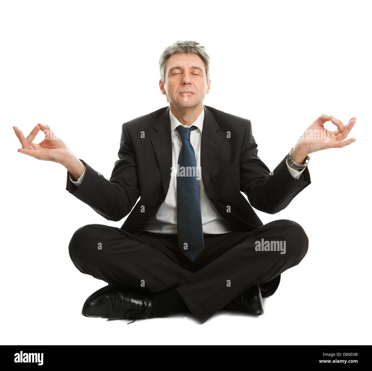 Businessman sitting in lotus position de yoga. Isolated on white Banque D'Images