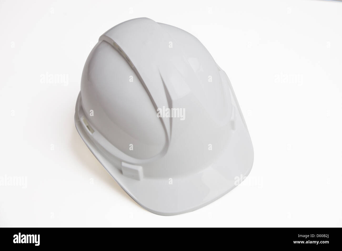 Close-up of hard hat over white background Banque D'Images