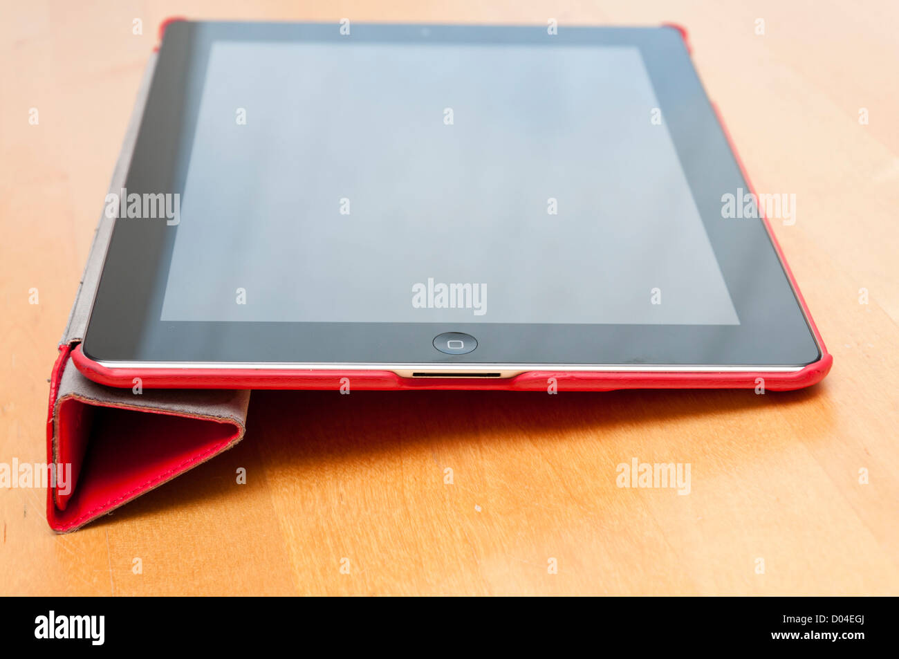 Dans l'ordinateur tablette Ipad housse rouge Banque D'Images