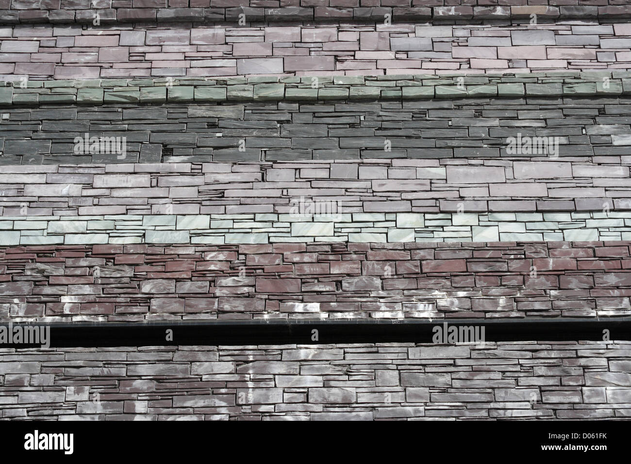 Motifs dans la maçonnerie du Millennium Centre à Cardiff Bay, pays de Galles architecture texture matériaux naturels bâtiment emblématique en pierre Banque D'Images