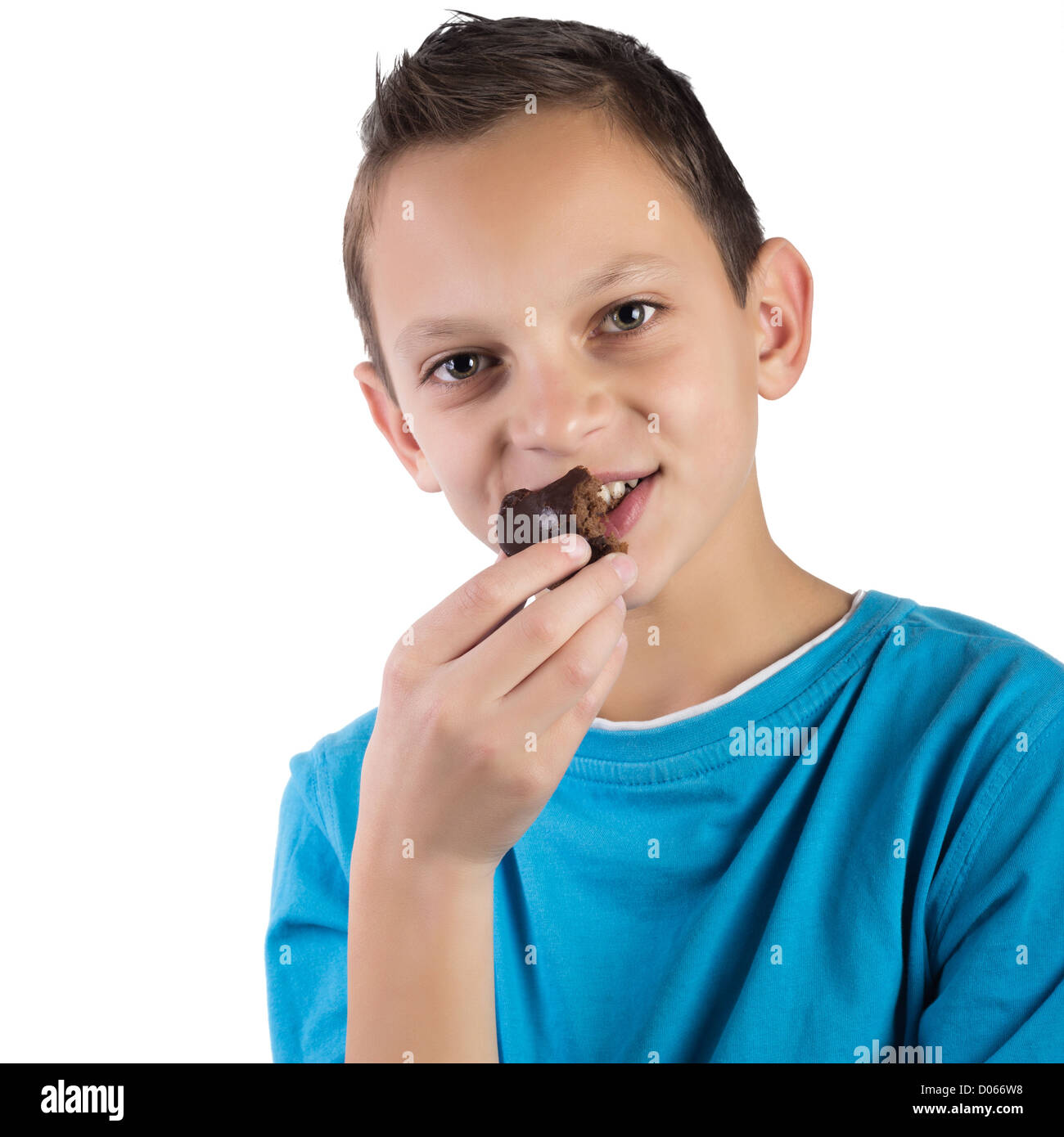 Close up of Adorable boy eating cookies Banque D'Images