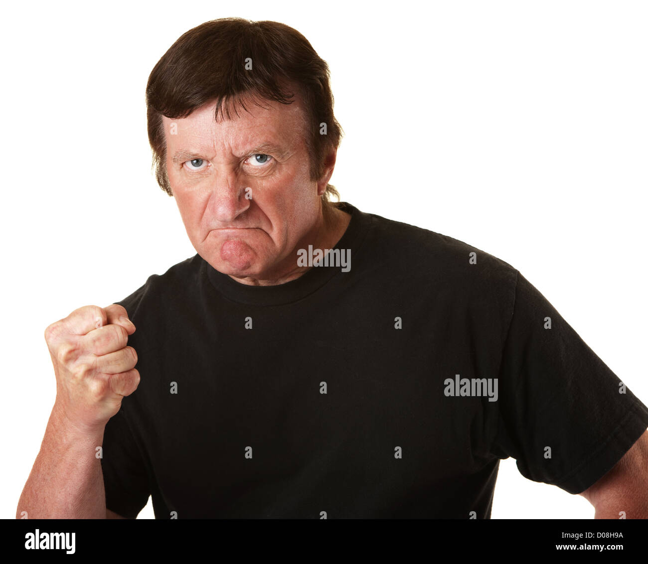 Angry Caucasian man with poing serré sur fond blanc Banque D'Images