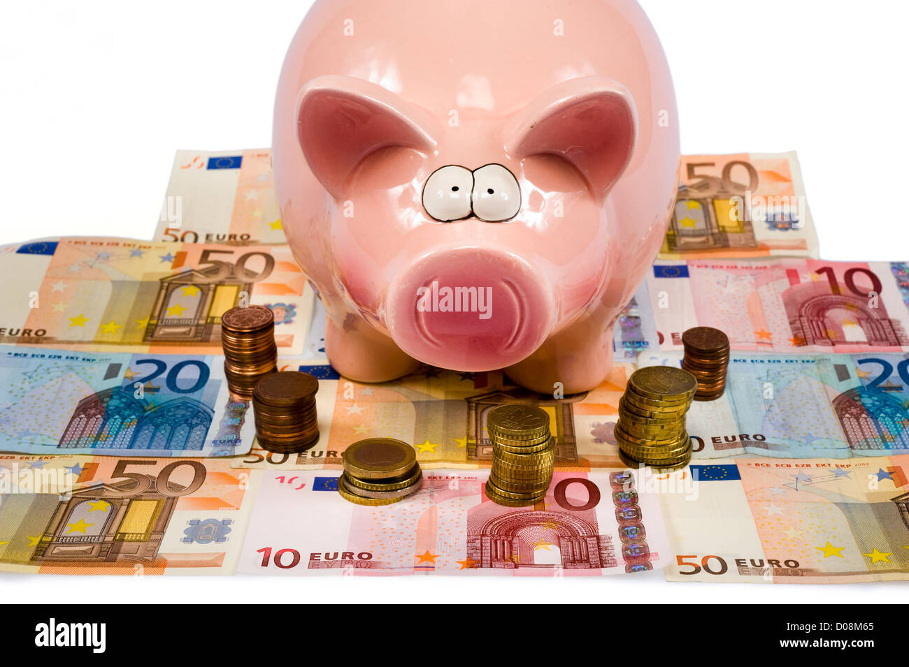 Un enregistrement de porc est debout sur le papier-monnaie euro Banque D'Images