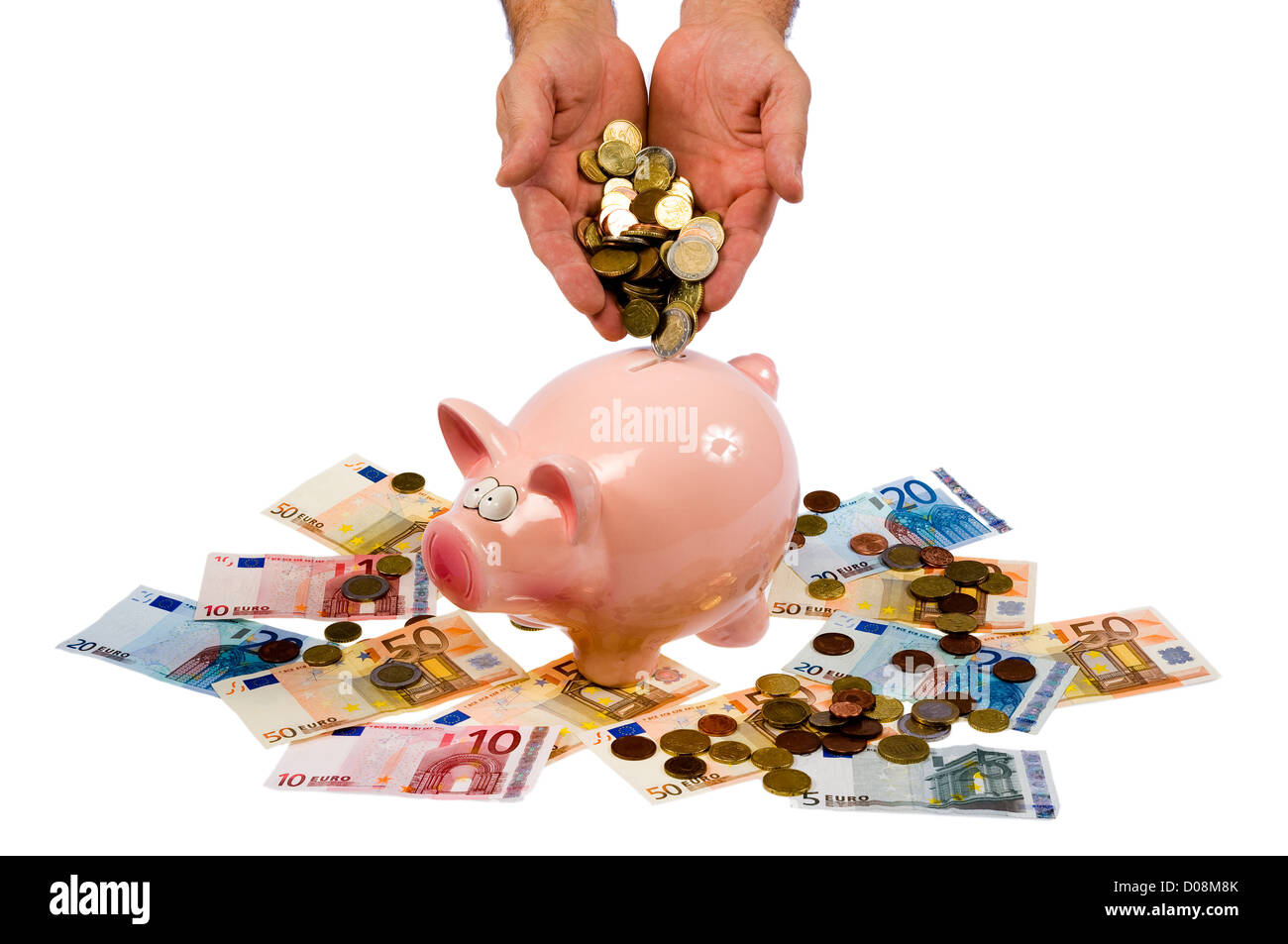 Deux mains sont dumping d'euros dans une économie pig Banque D'Images