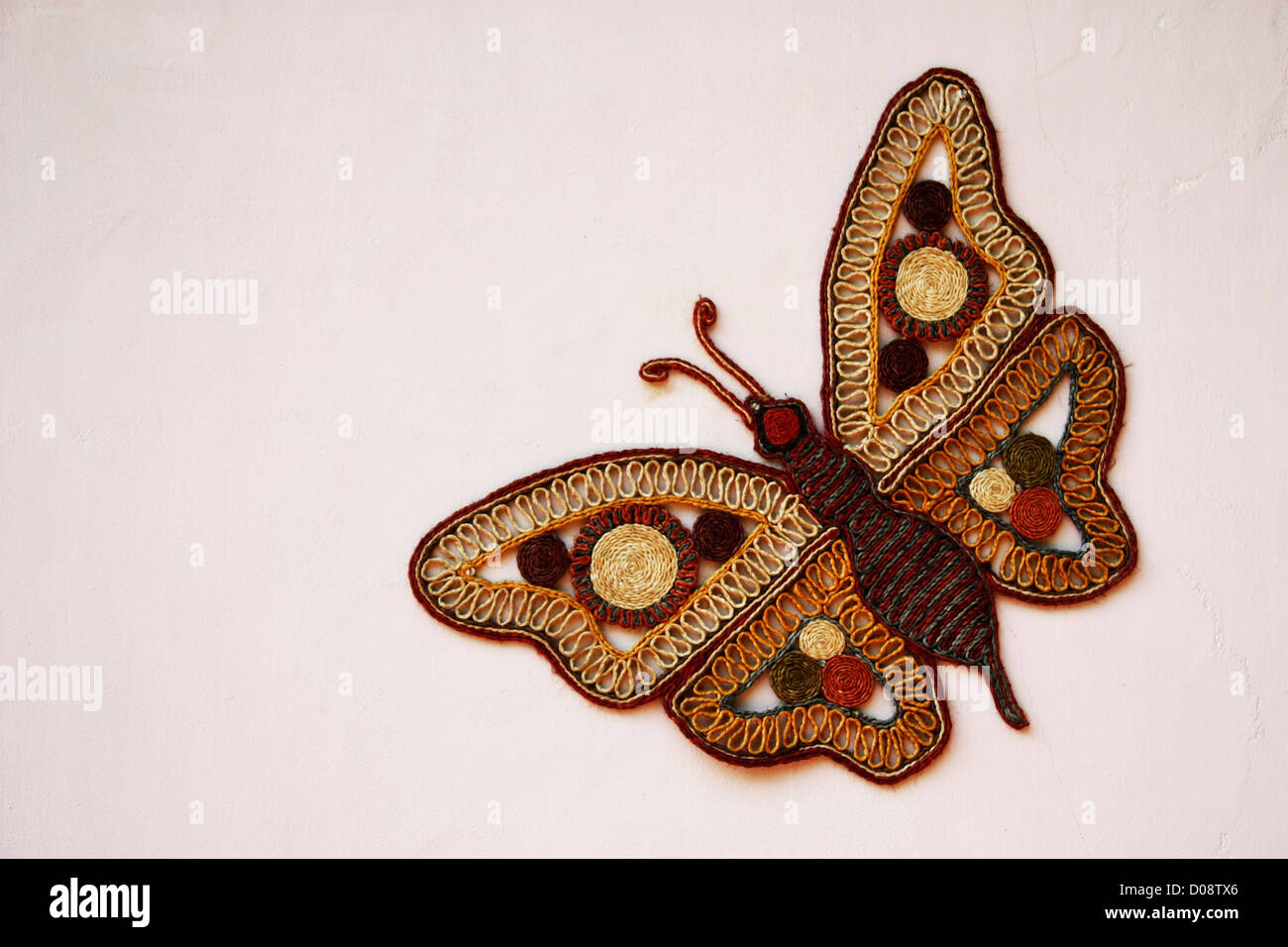 Un dessin de papillon sur le mur de l'artisanat Banque D'Images