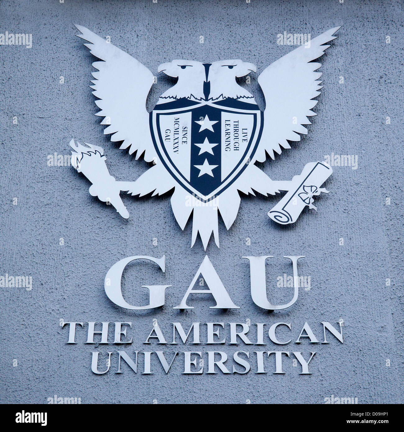 GAU l'Université américaine à Canterbury en Angleterre. Inscrivez-vous sur mur à l'extérieur. Banque D'Images