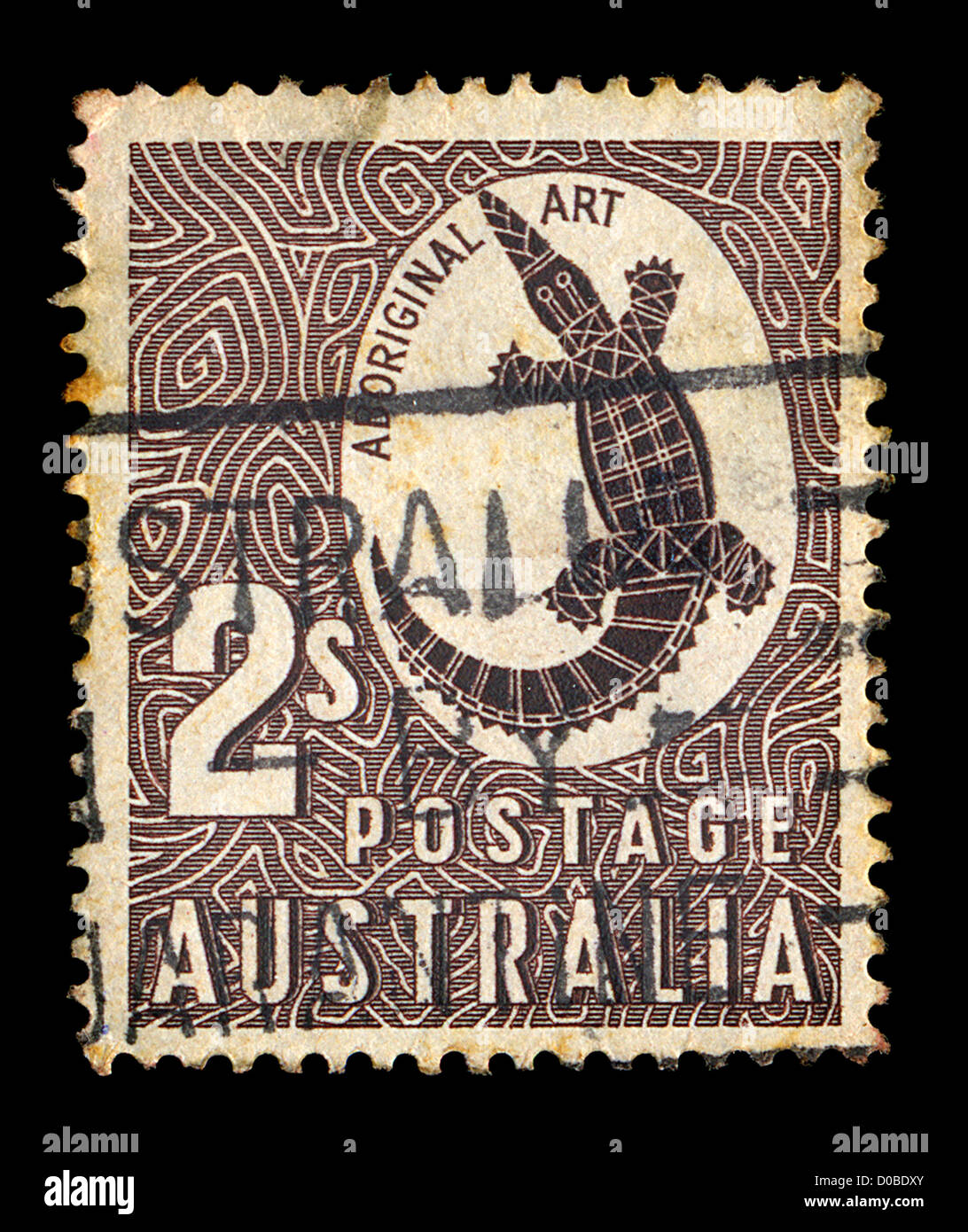 Timbre Vintage imprimé par la poste australienne avec les autochtones de la sculpture art rock un crocodile illustration, vers 1948. Banque D'Images